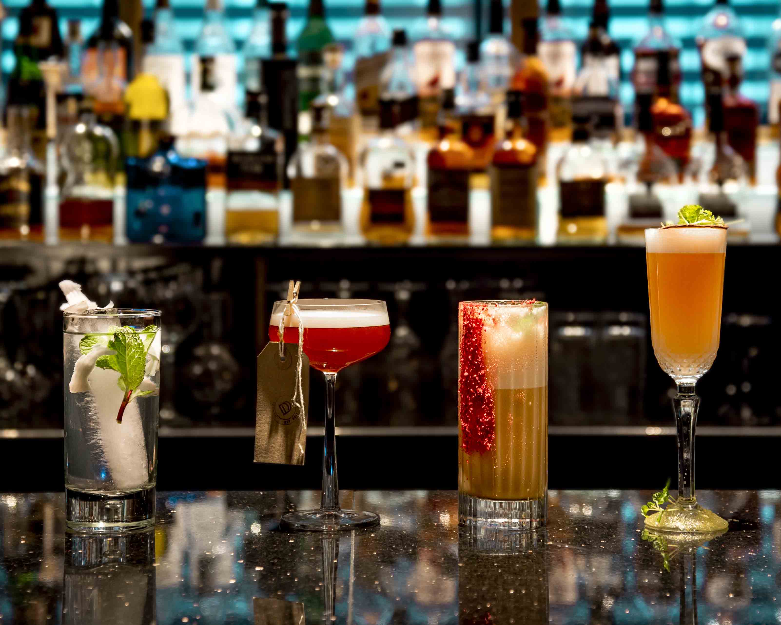 4 cocktails on a bar at the Dakota Hotel